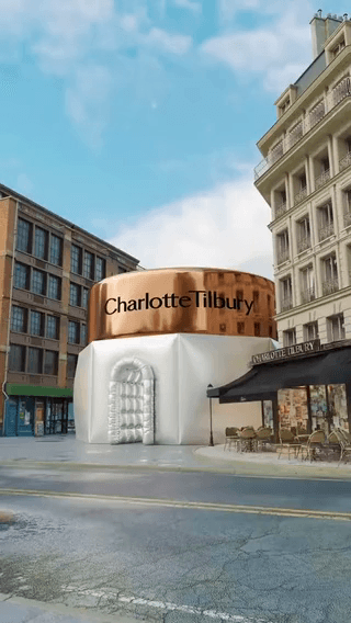 Charlotte Tilbury: a copper-roofed cream pavilion on a city plaza